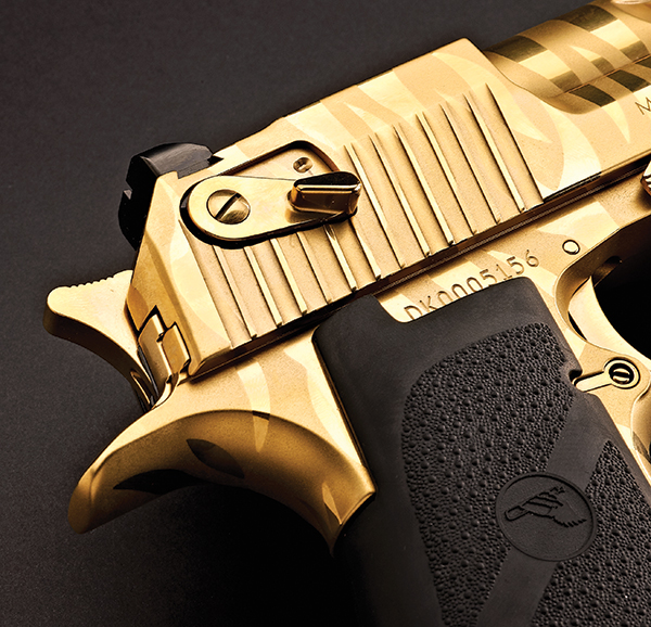 The newest version of the Desert Eagle wears a titanium gold with tiger str...