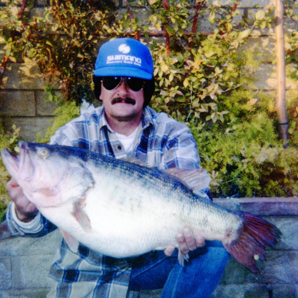 Robert Crupi displaying his gigantic lunker taken on a herring jig out. The massive fish was pulled out of 40 ft of water.