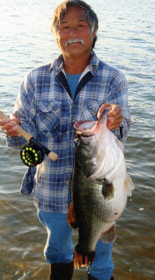 Larry Kuroaski with his record lunker taken on a fly-rod setup on 8 lb tippet. This fish has the famous black mark on her stomach.