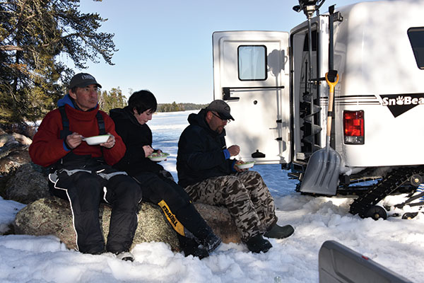 Eating Shore Lunch While Lake Trout fishing on the Canadian Shield