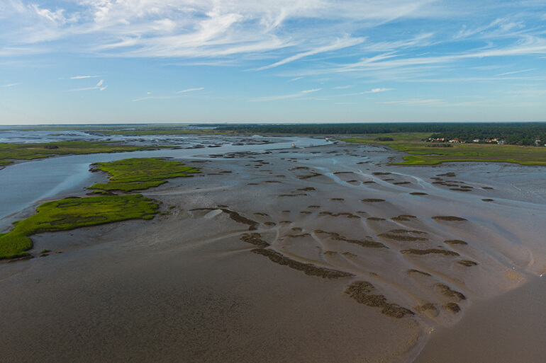 aerial view of exposed oyster bars during negative tide
